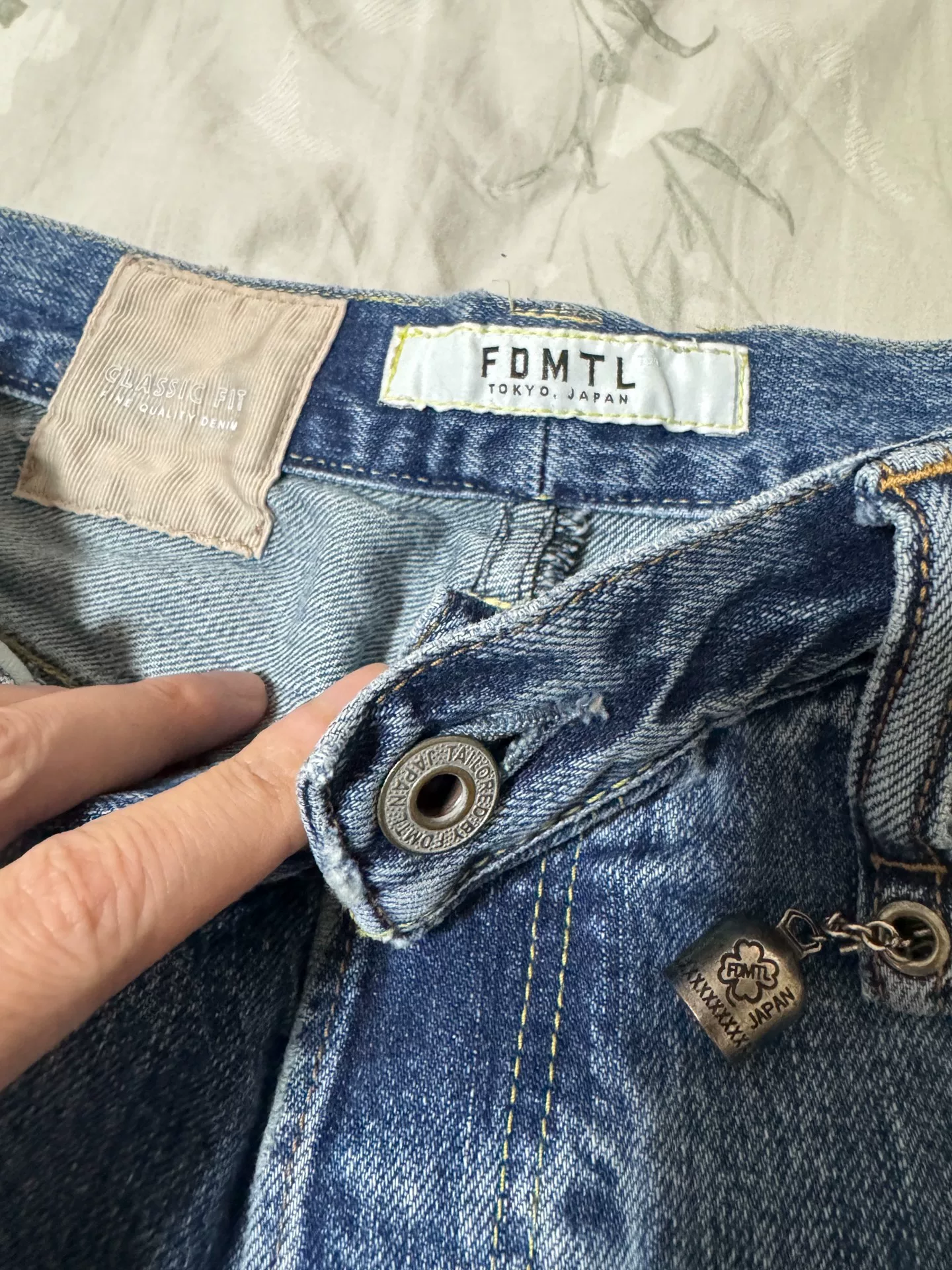 FDMTL 23AW Red Thread Distressed Jeans — detail