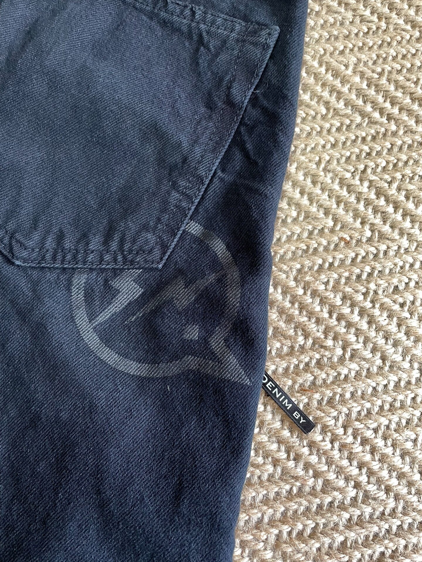 Vanquish & Fragment Distressed Washed Denim Pants — label
