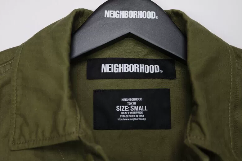 NEIGHBORHOOD COMBAT Utility Jacket — label