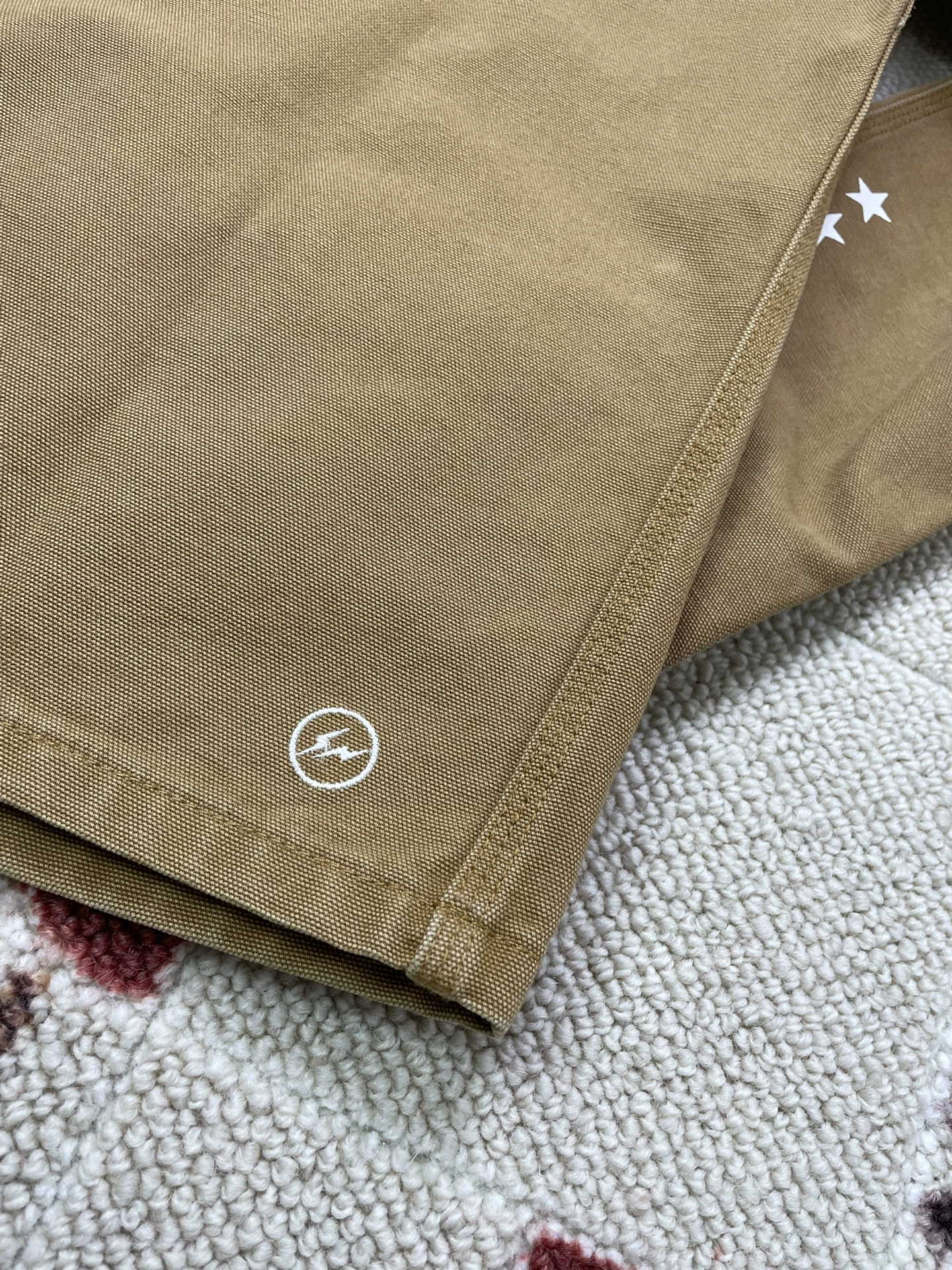 Carhartt x Uniform Experiment UE Jacket — label
