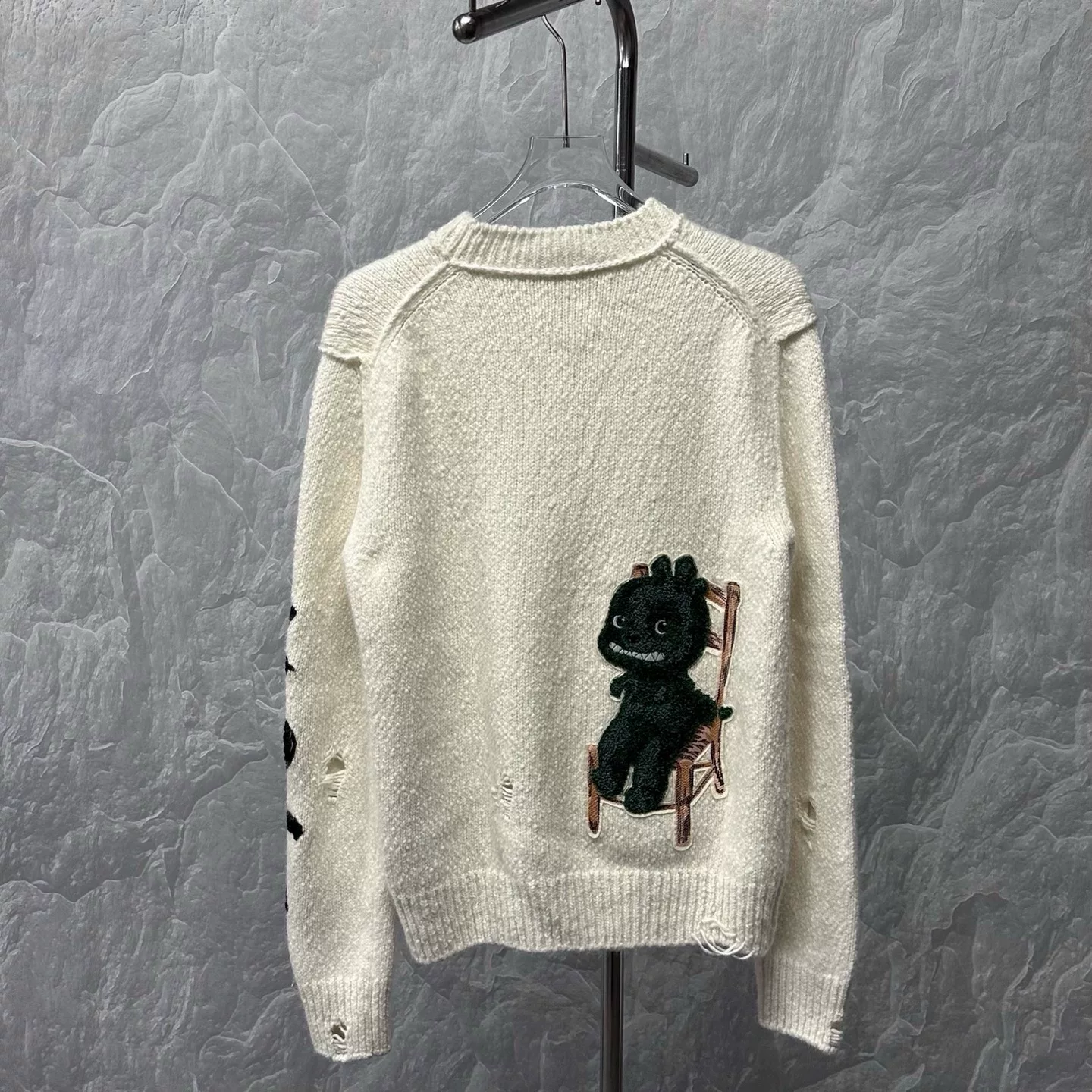 Dior SS24 Dinosaur Knit Distressed Sweater — label