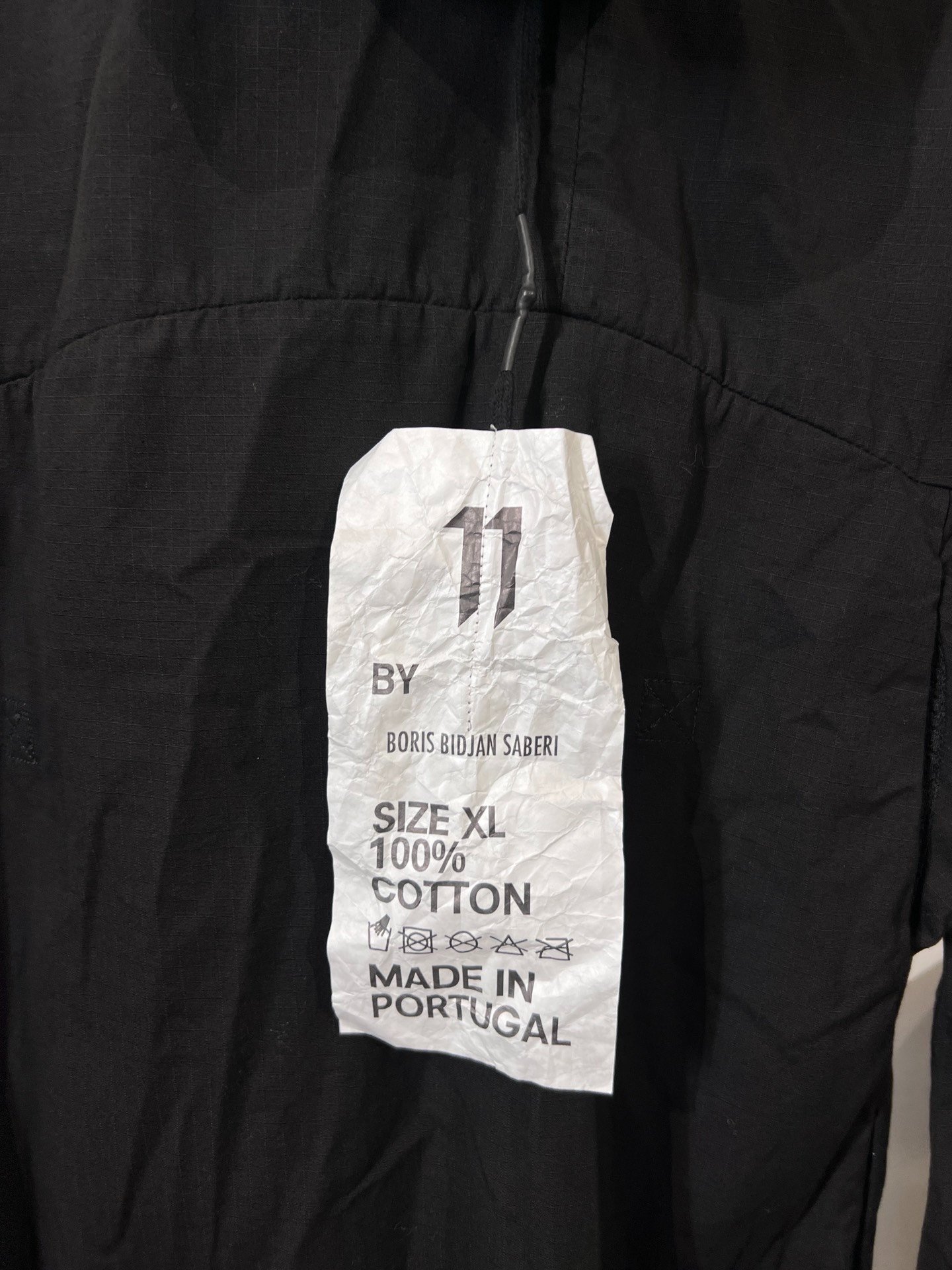 Boris Bidjan Saberi S3 Mid-Length Coat — label