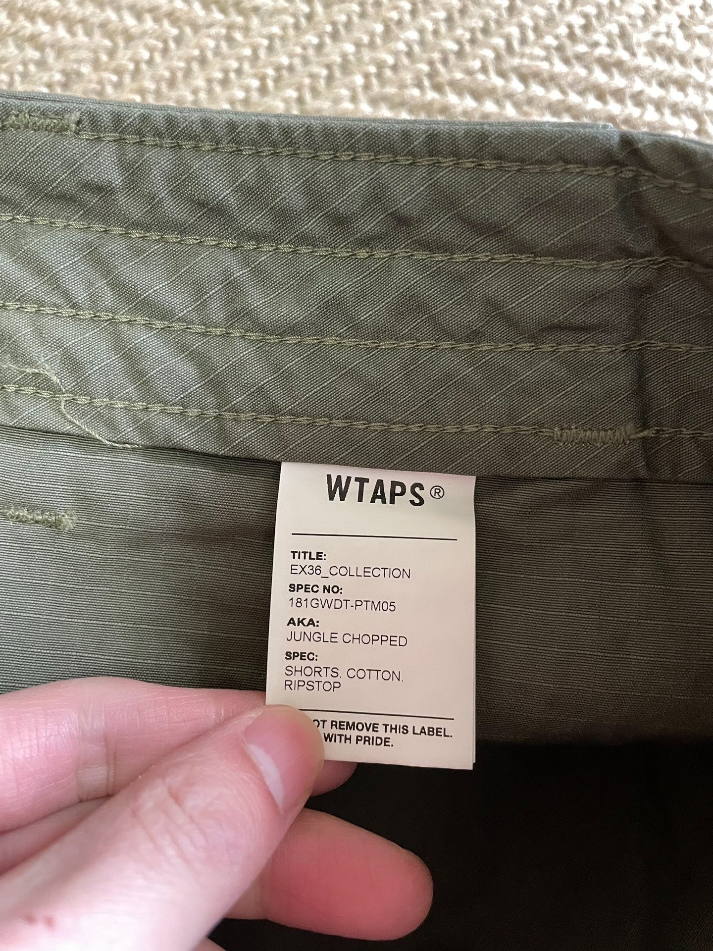 WTAPS JUNGLE CHOPPED SHORTS — label