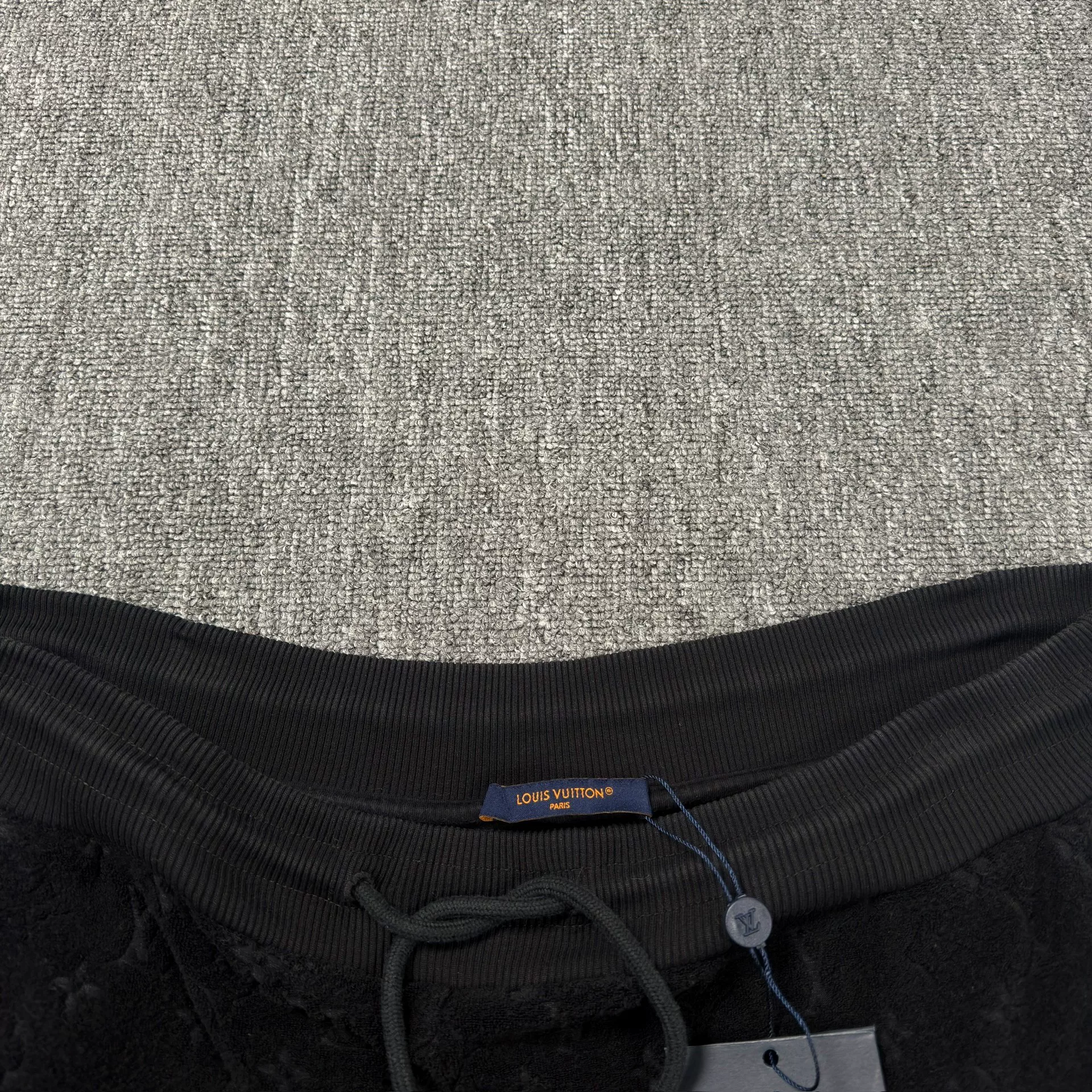 Louis Vuitton Black All-Over Print Shorts — front