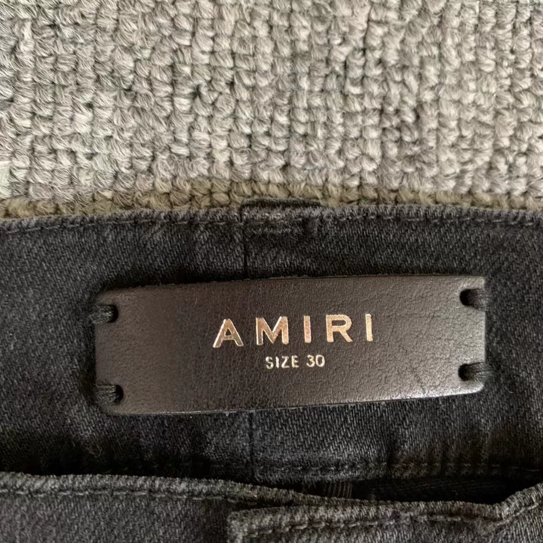 Amiri Black Distressed Knee Jeans — detail
