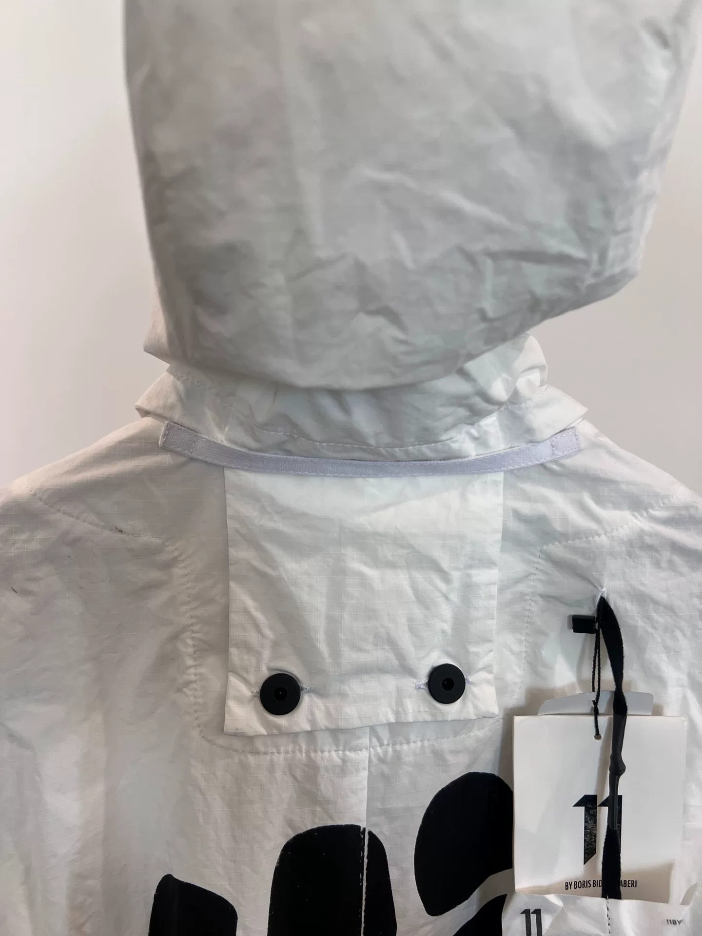Boris Bidjan Saberi Mid-Length Fist Print Parka — label